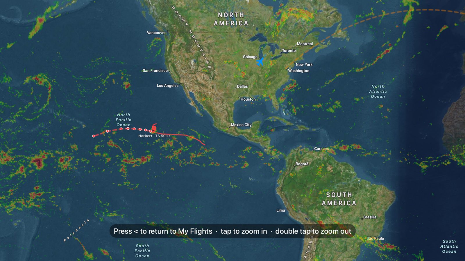FlighTV explore mode showing weather radar and a tropical storm over the Pacific